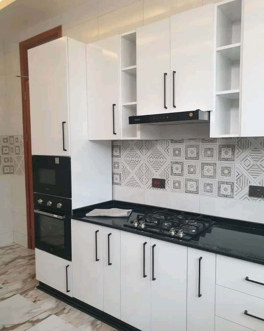 Kitchen cabinets design in Kampala Uganda. Wood cabinets installation. Trust Interiors Uganda. Leading interior design company in Uganda. Services: Interior design services, installation services, manufacturing of modern stylish furniture products in Uganda, East Africa. ugabox.com